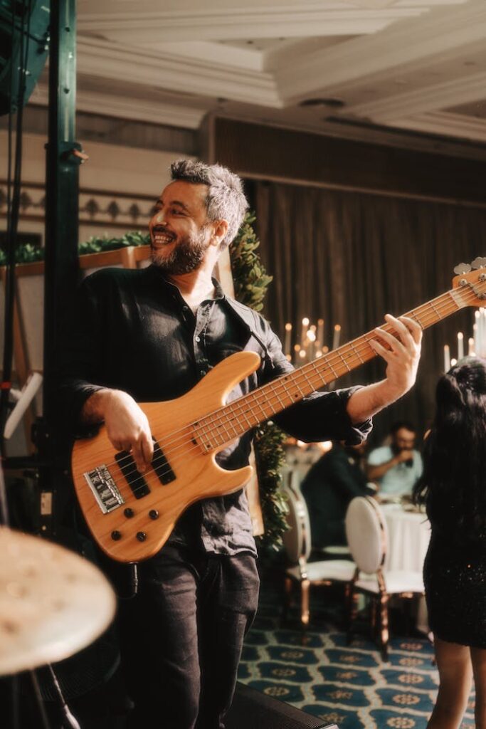 Man Playing Guitar during Party